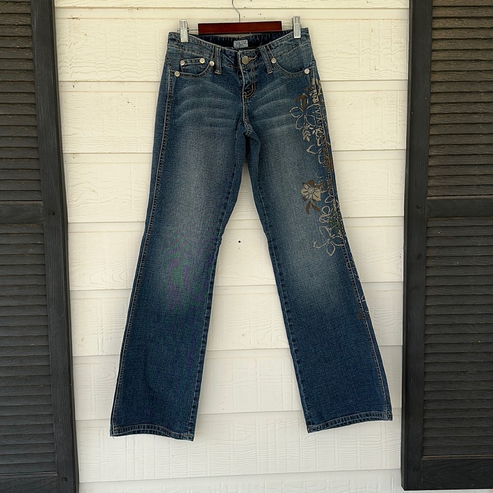 Women’s jeans with painted designs.